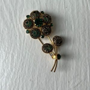 Green gem and gold vintage pin